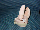 Lateral view of custom gripping device showing pivotal axis points. - Garrison's Prosthetic Services